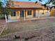 Spacious backyard featuring a covered patio, xeriscaping, and block wall fencing at 4534 E Villa Maria Dr, Phoenix, AZ 85032