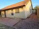 View of the side yard and rear of home, featuring a tile roof and xeriscaping at 4534 E Villa Maria Dr, Phoenix, AZ 85032