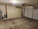 The garage features built-in storage cabinets, offering ample space for organization at 4534 E Villa Maria Dr, Phoenix, AZ 85032