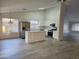 Bright and airy kitchen featuring stainless steel appliances, tiled countertops and wood-look floors at 4534 E Villa Maria Dr, Phoenix, AZ 85032