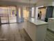 Bright kitchen featuring stainless steel appliances, tile countertops, and sliding glass doors to the outdoor area at 4534 E Villa Maria Dr, Phoenix, AZ 85032