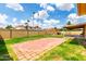 Well maintained backyard features a brick patio, play structure and grassy areas at 4802 W Hayward Ave, Glendale, AZ 85301
