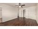 This bedroom features wood-look floors and a closet with sliding doors at 4802 W Hayward Ave, Glendale, AZ 85301