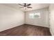 Bedroom with hardwood floors, ceiling fan, and window at 4802 W Hayward Ave, Glendale, AZ 85301