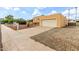 View of the home's front exterior and driveway, leading to the garage at 4802 W Hayward Ave, Glendale, AZ 85301