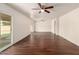 Bright living room featuring new flooring, fresh paint and large sliding glass door at 4802 W Hayward Ave, Glendale, AZ 85301