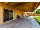 Covered patio with two chairs offering an outdoor living space at 4802 W Hayward Ave, Glendale, AZ 85301