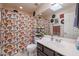 Full bathroom featuring a shower with a mushroom-themed curtain and plants at 4912 W Marco Polo Rd, Glendale, AZ 85308