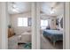 Two bedrooms with ceiling fans, window and carpeted floors at 4912 W Marco Polo Rd, Glendale, AZ 85308