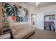 Comfortable bedroom with a sofa, desk, and ample natural light at 4912 W Marco Polo Rd, Glendale, AZ 85308
