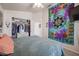 Inviting bedroom featuring a closet and a colorful tapestry as decor at 4912 W Marco Polo Rd, Glendale, AZ 85308