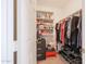 Closet features shelving, hanging storage, and a red stool, maximizing organization and functionality at 4912 W Marco Polo Rd, Glendale, AZ 85308