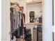 Organized closet with ample space for clothing, speaker system, and storage containers at 4912 W Marco Polo Rd, Glendale, AZ 85308