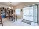Dining area with sliding glass door to covered patio at 4912 W Marco Polo Rd, Glendale, AZ 85308