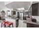 Spacious kitchen with granite countertops, stainless steel appliances, and breakfast bar at 4912 W Marco Polo Rd, Glendale, AZ 85308