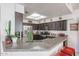Bright kitchen with granite countertops and stainless steel appliances at 4912 W Marco Polo Rd, Glendale, AZ 85308