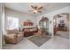 Inviting living room with tile floors and a cozy seating area at 4912 W Marco Polo Rd, Glendale, AZ 85308