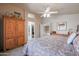 Main bedroom with view of closet and bathroom, vaulted ceiling, and wooden furnishings at 4912 W Marco Polo Rd, Glendale, AZ 85308