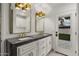 Stylish bathroom with double sinks, quartz countertops, gold accents, and ample cabinet space at 5309 E Hearn Rd, Scottsdale, AZ 85254