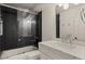 Contemporary bathroom featuring a sleek glass-enclosed shower, black subway tiles, and a modern vanity at 5309 E Hearn Rd, Scottsdale, AZ 85254