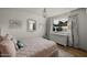 Bright bedroom featuring a comfortable bed, white dresser, charming decor, and natural light from the window at 5309 E Hearn Rd, Scottsdale, AZ 85254