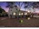 Charming single story home featuring desert landscaping, privacy wall, and picturesque setting at sunset at 5309 E Hearn Rd, Scottsdale, AZ 85254