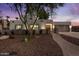 Attractive single-story home showcasing desert landscaping, a gated walkway, and an attached two-car garage at 5309 E Hearn Rd, Scottsdale, AZ 85254