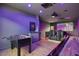 Entertainment haven featuring a foosball table, shuffleboard, projector, and comfortable seating at 5309 E Hearn Rd, Scottsdale, AZ 85254