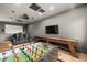 Entertain in this large game room, complete with foosball table, shuffleboard, and theatre screen for film nights at 5309 E Hearn Rd, Scottsdale, AZ 85254