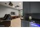 Enjoy the convenience of a built-in wet bar complete with marble countertop and wine fridge, adjacent to the theatre at 5309 E Hearn Rd, Scottsdale, AZ 85254