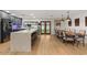Open kitchen and dining area featuring a quartz countertop island, stainless appliances, and hardwood floors at 5309 E Hearn Rd, Scottsdale, AZ 85254