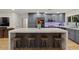 Bright kitchen featuring a large island with seating, stainless steel appliances, and gray cabinets at 5309 E Hearn Rd, Scottsdale, AZ 85254