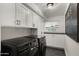 Well-organized laundry room with modern appliances, built-in cabinets, and a convenient layout at 5309 E Hearn Rd, Scottsdale, AZ 85254