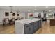 Open floor plan showcasing a seamless transition from the kitchen to the living area with modern decor and ample lighting at 5309 E Hearn Rd, Scottsdale, AZ 85254