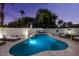 Freeform pool with baja shelf for tanning and ample seating for entertaining and relaxing at 5309 E Hearn Rd, Scottsdale, AZ 85254