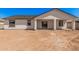 The house features a covered patio and large backyard with plentiful space for recreational activities at 5499 E Red Bird Ln, San Tan Valley, AZ 85140