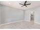 Spacious bedroom with marble flooring, modern ceiling fan and ensuite bathroom at 5499 E Red Bird Ln, San Tan Valley, AZ 85140