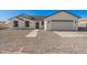Charming single-story home with a well-maintained yard and attached two-car garage, perfect for Gathering living at 5499 E Red Bird Ln, San Tan Valley, AZ 85140