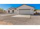 Beautiful single-story home with a pristine two-car garage and a gravel-covered yard offering modern comfort at 5499 E Red Bird Ln, San Tan Valley, AZ 85140