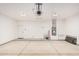 A spacious, clean garage with water heater and ample room for parking and storage, and utility sink at 5499 E Red Bird Ln, San Tan Valley, AZ 85140