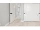 Hallway features a light-filled hallway with marble floors, white walls, and closet with sliding doors at 5499 E Red Bird Ln, San Tan Valley, AZ 85140