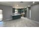 Open-concept kitchen featuring stylish countertops, modern cabinetry, stainless steel appliances, and a spacious island at 5499 E Red Bird Ln, San Tan Valley, AZ 85140