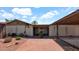 Charming single-story home with lush desert landscaping and covered entry at 7120 N Via De La Sendero --, Scottsdale, AZ 85258