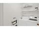 Bright laundry room with white washer and dryer and wire shelving for storage at 7120 N Via De La Sendero --, Scottsdale, AZ 85258
