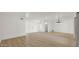 Open-concept living space with new flooring and modern light fixture, freshly painted white at 7120 N Via De La Sendero --, Scottsdale, AZ 85258