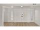 Bright, airy living room with new flooring, freshly painted walls, and double door entry at 7120 N Via De La Sendero --, Scottsdale, AZ 85258