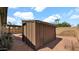 Backyard storage shed with slat vents and surrounding low-maintenance desert landscaping at 7120 N Via De La Sendero --, Scottsdale, AZ 85258