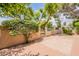 Private backyard features a patio and beautiful trees offering natural shade at 8171 E Del Caverna Dr, Scottsdale, AZ 85258