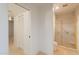Bathroom featuring a glass enclosed shower, a toilet, and a walk-in closet at 8171 E Del Caverna Dr, Scottsdale, AZ 85258