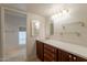 Bright bathroom features wood cabinets, modern countertops, and lots of vanity space at 8171 E Del Caverna Dr, Scottsdale, AZ 85258